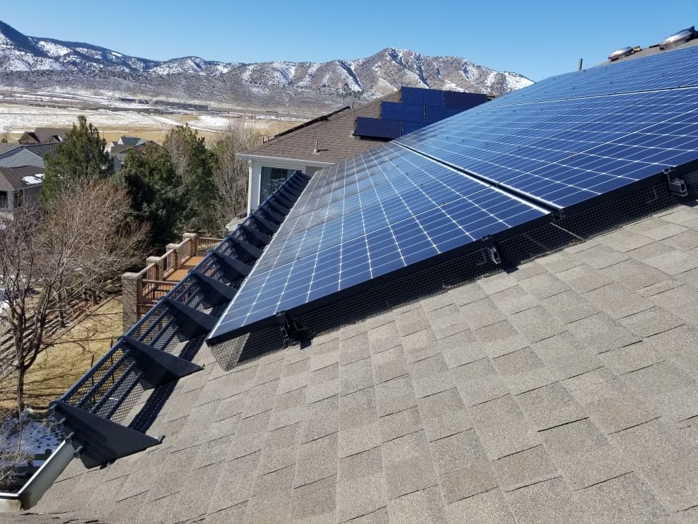 Solar Panel Snow Retention With Roof Snow Fences