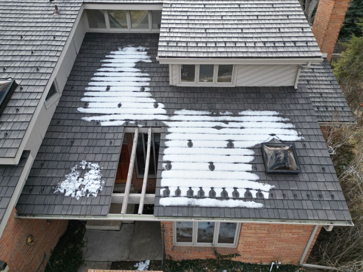 Slick Synthetic Shingles Require Snow Guards