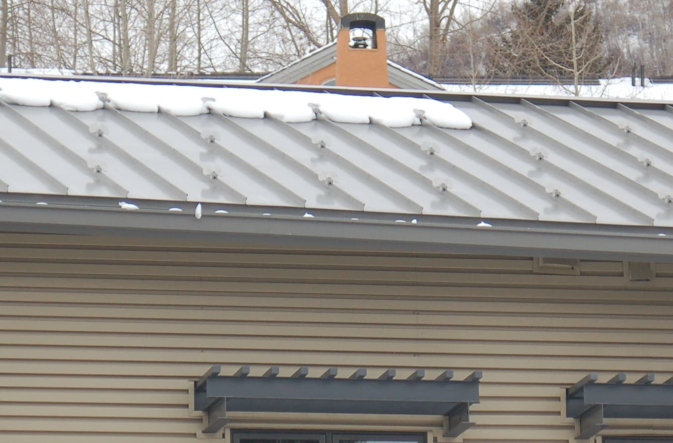 Clamp-to-Seam Snow Guards for Standing-Seam Roofs vs Clamp-to-Seam Snow Fences
